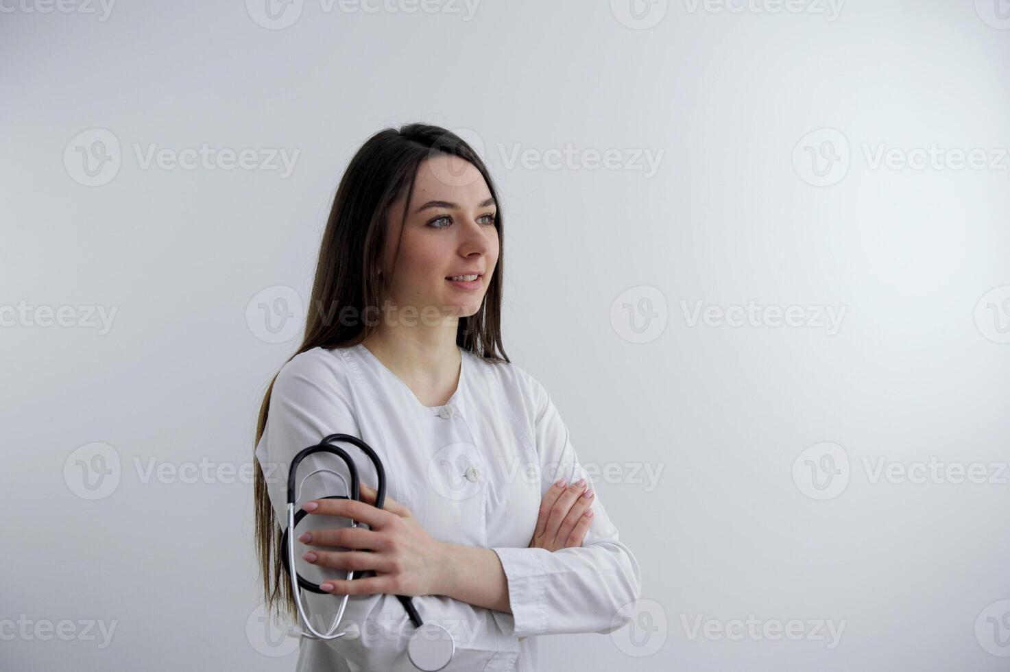 Image of happy young business woman posing isolated over grey wall background. Trainee doctor with pads and period calendar on background photo