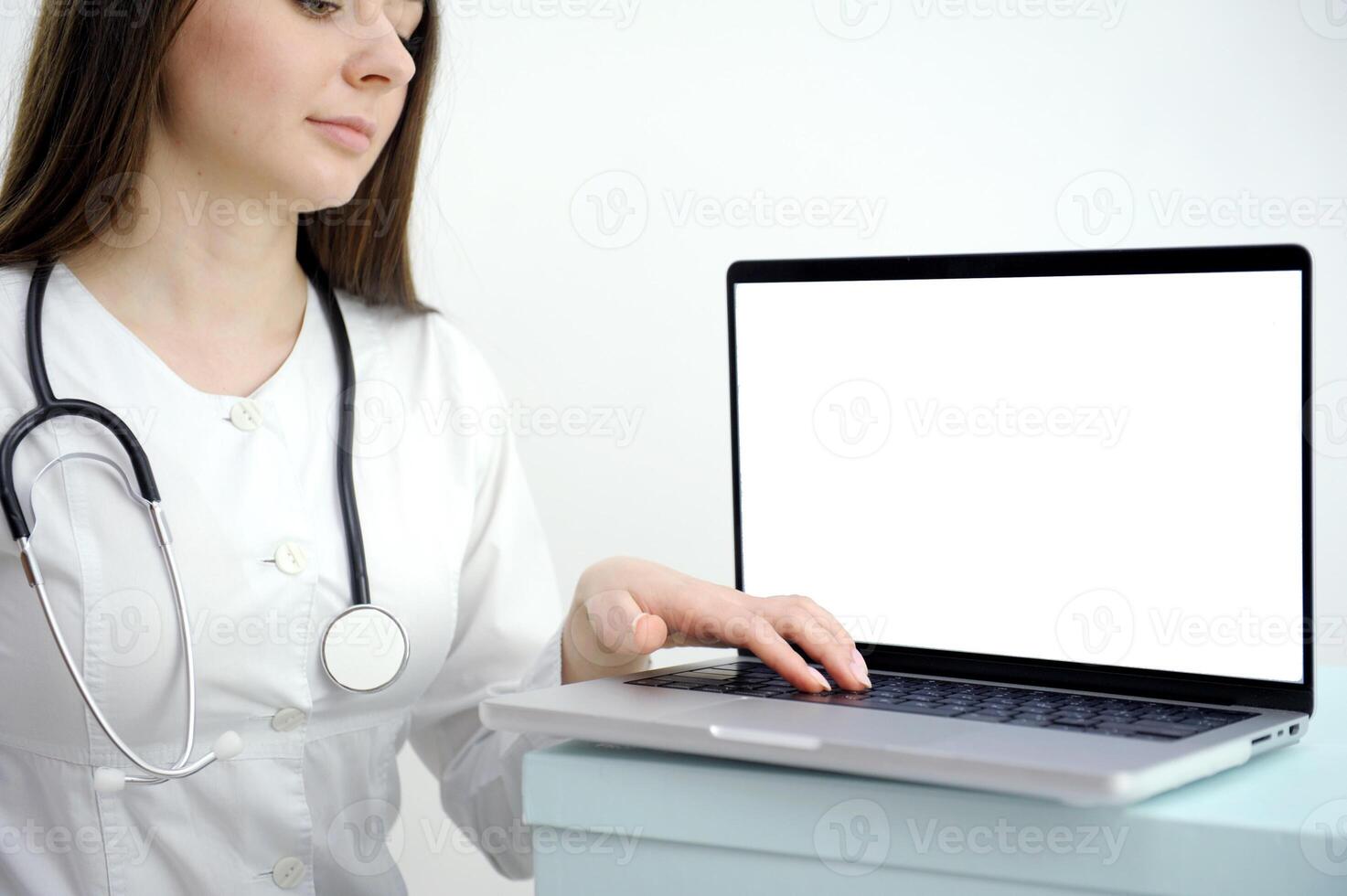 cropped shot of female doctor showing tablet with blank screen to patient at office photo