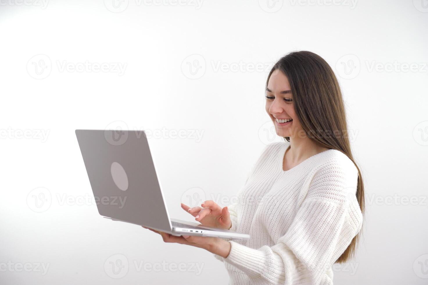 banner girl with laptop in headphones communicates online conference with friends waving a lot of space for text ad gadgets online courses internet social networks Web studio woman beautiful teeth photo
