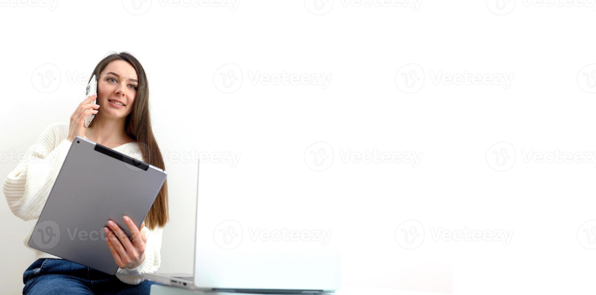 Young latina female work with financial papers at home count on calculator before paying taxes receipts online by phone. Millennial woman planning budget glad to find chance for economy saving money photo