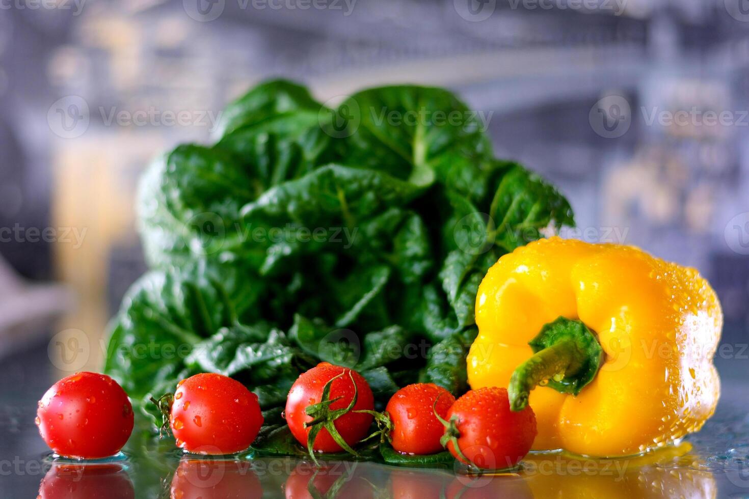 Closeup on vegetables on cutting board and young housewife in background Assortment of fresh vegetables at market photo