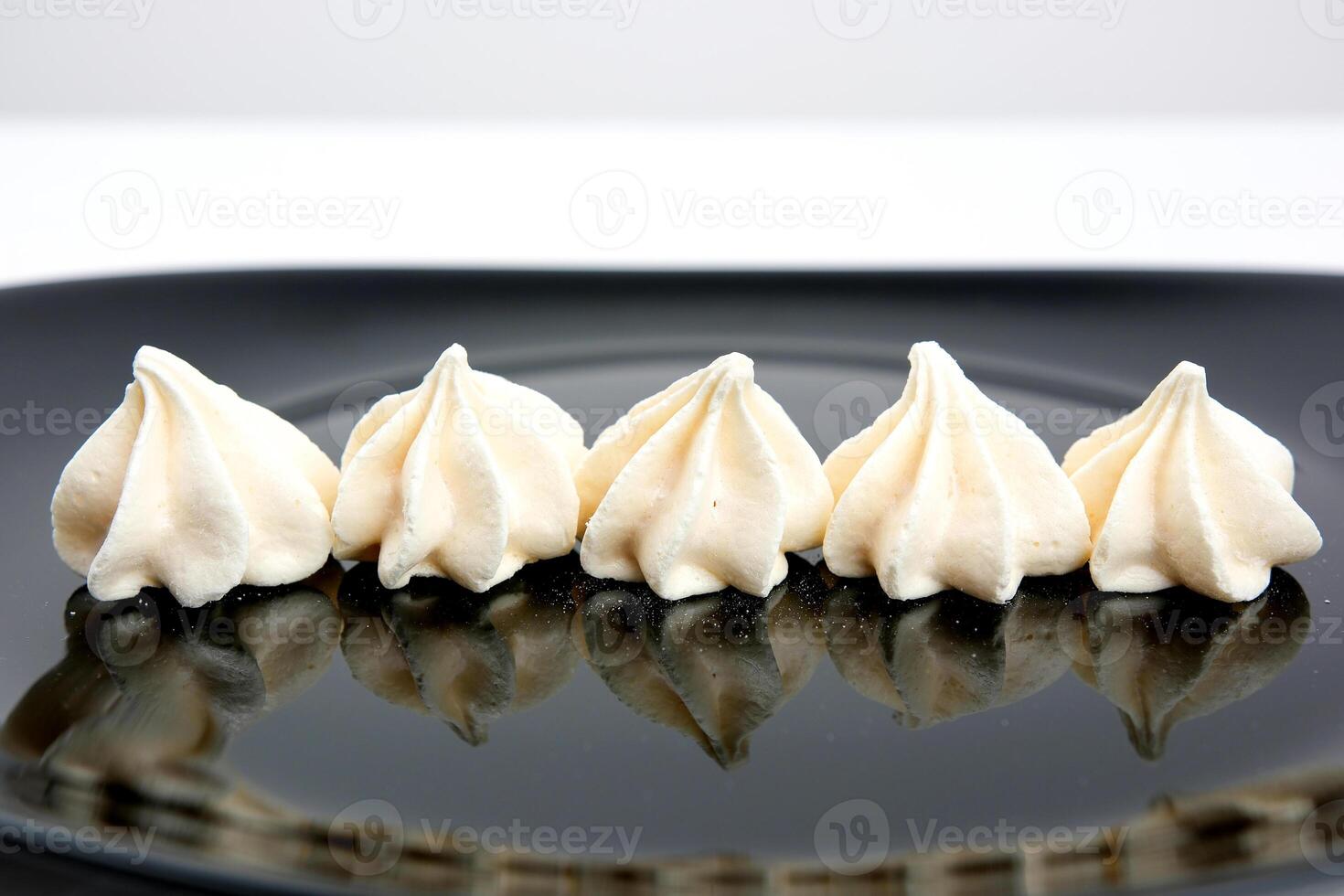 Meringue. sweet meringues. Meringue tray. Close up photo of meringues. Dessert Background.Merengue