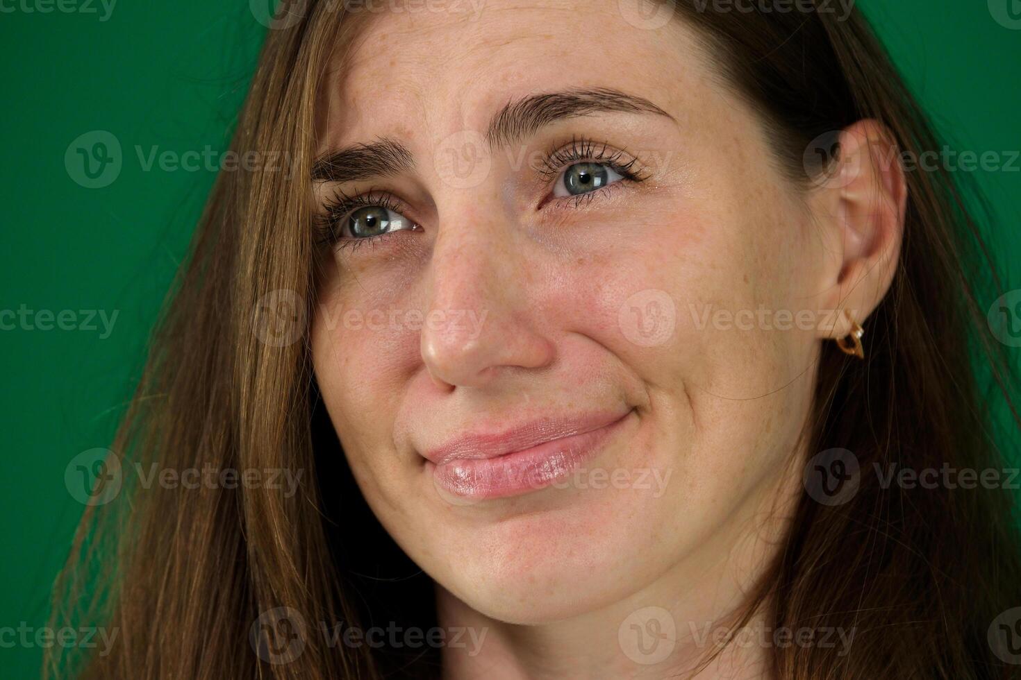 Young depressed woman sitting on sofa in living room. She feeling sad and worried suffering depression in mental health. photo