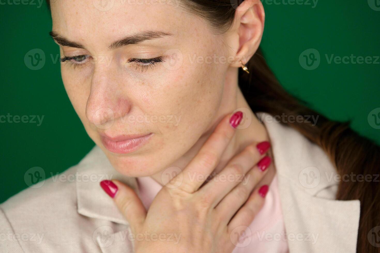 Illness, Health Care, people, Medicine concept Throat Pain. Closeup Of Sick Woman With Sore Throat Feeling Bad, Suffering From Painful Swallowing. Beautiful Girl Touching Neck With Hand photo