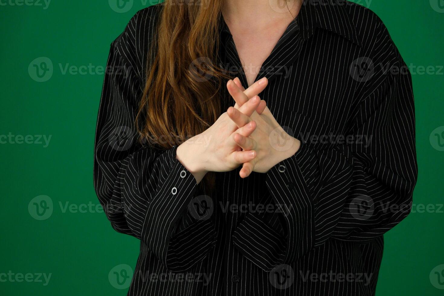 business black woman crossing her arms expression of emotions with hands unrecognizable people hands palms fingers close-up on a green background chromakey feelings photo