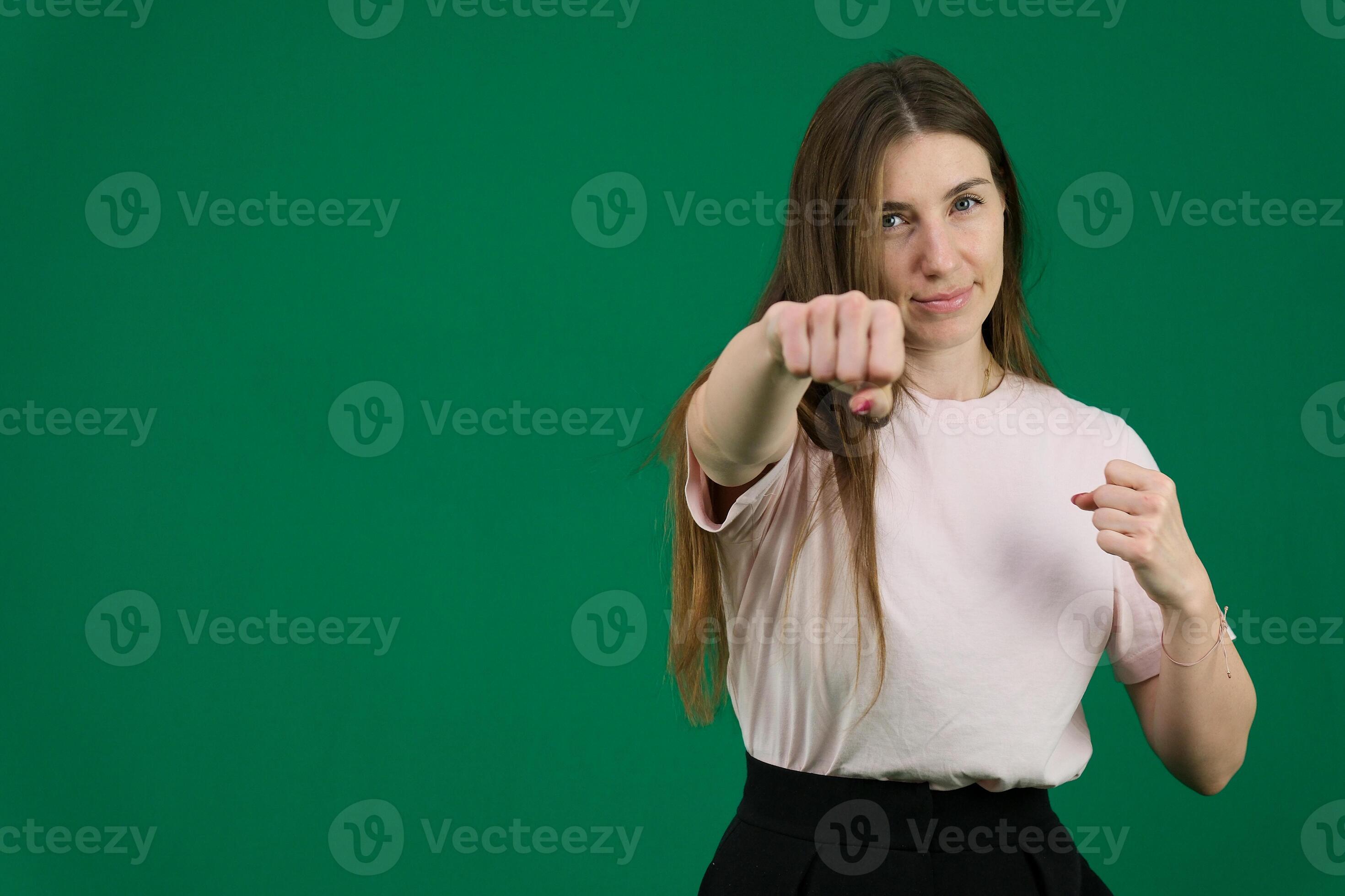 woman punching the air with her fists training at home 45983218 Stock Photo at Vecteezy