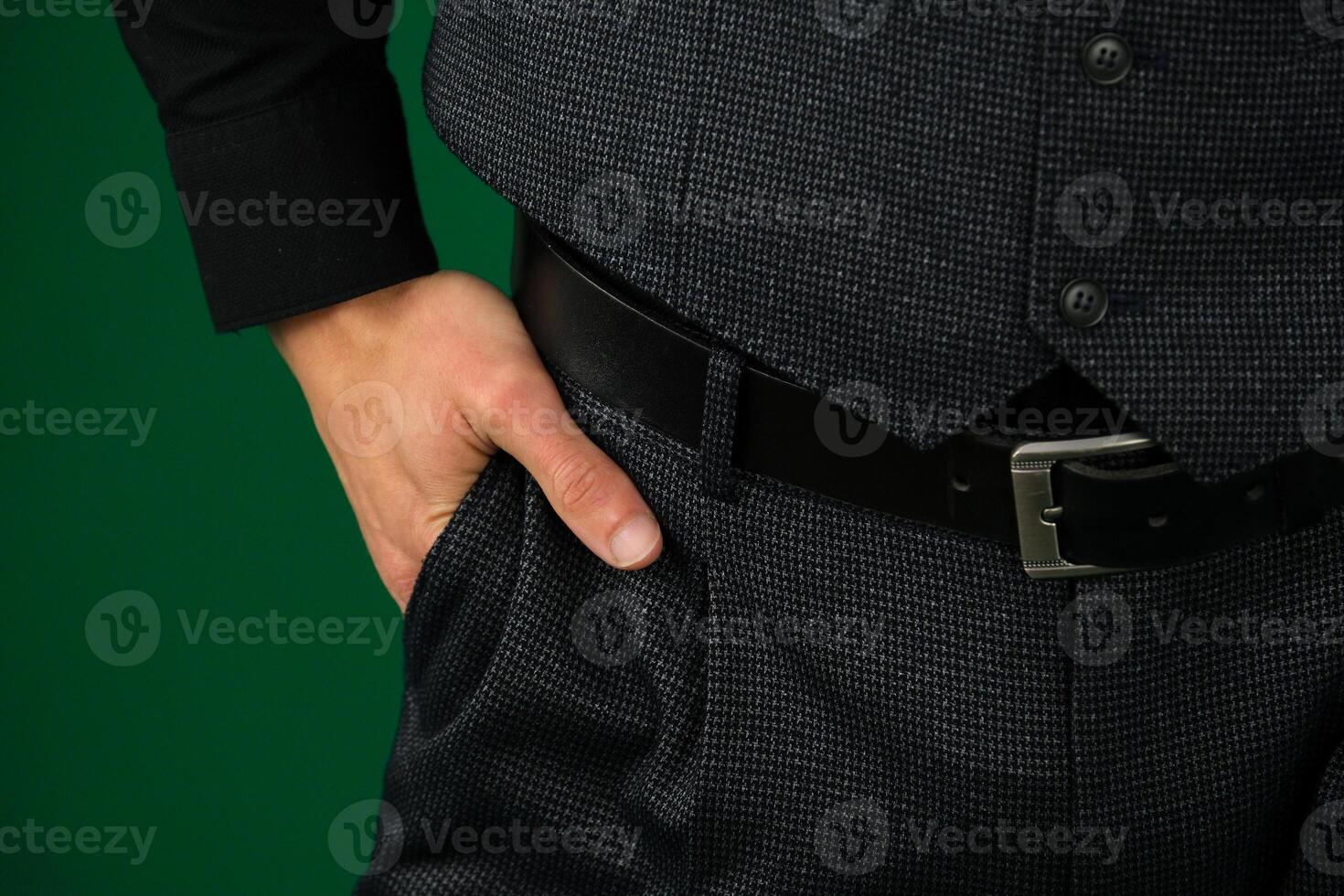 Corporate executive posing with hands in pockets photo