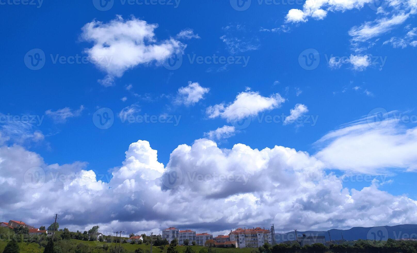 Clear blue sky texture and white fluffy cloud nature background. The sun shines bright in the daytime in summer photo