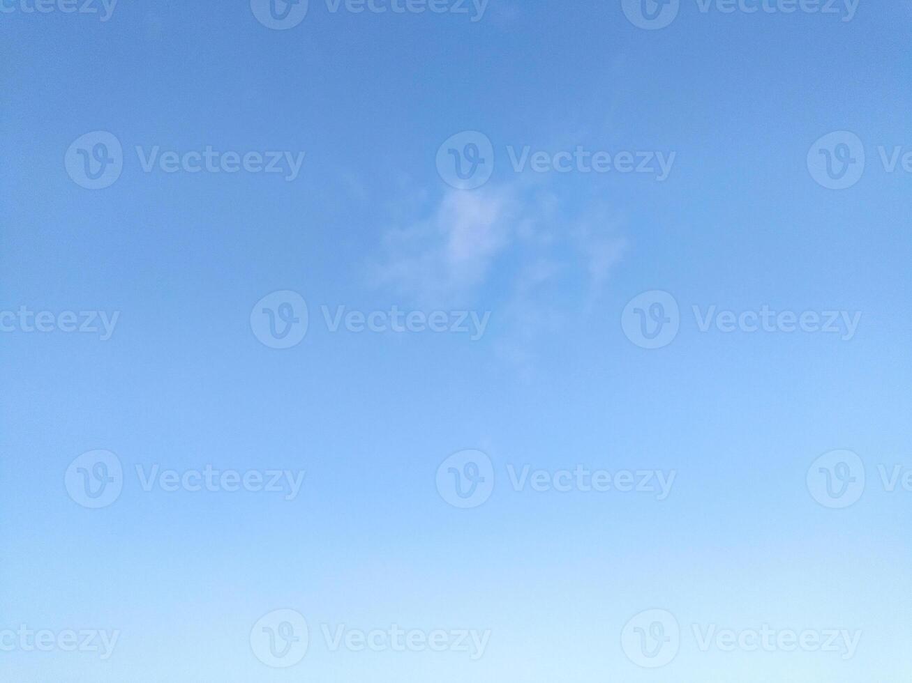 Clear blue sky texture and white fluffy cloud nature background. The sun shines bright in the daytime in summer photo