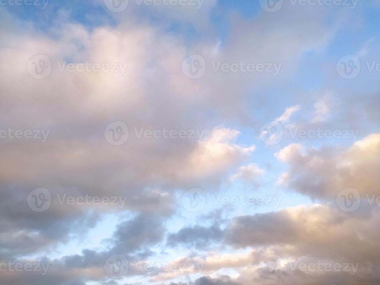 Sun Setting Over Clouds in Sky photo