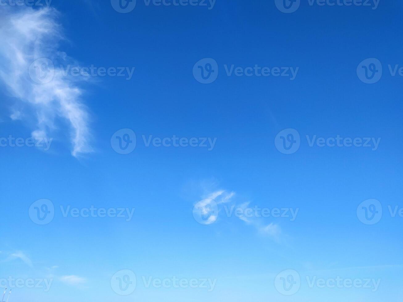 Clear blue sky texture and white fluffy cloud nature background. The sun shines bright in the daytime in summer photo