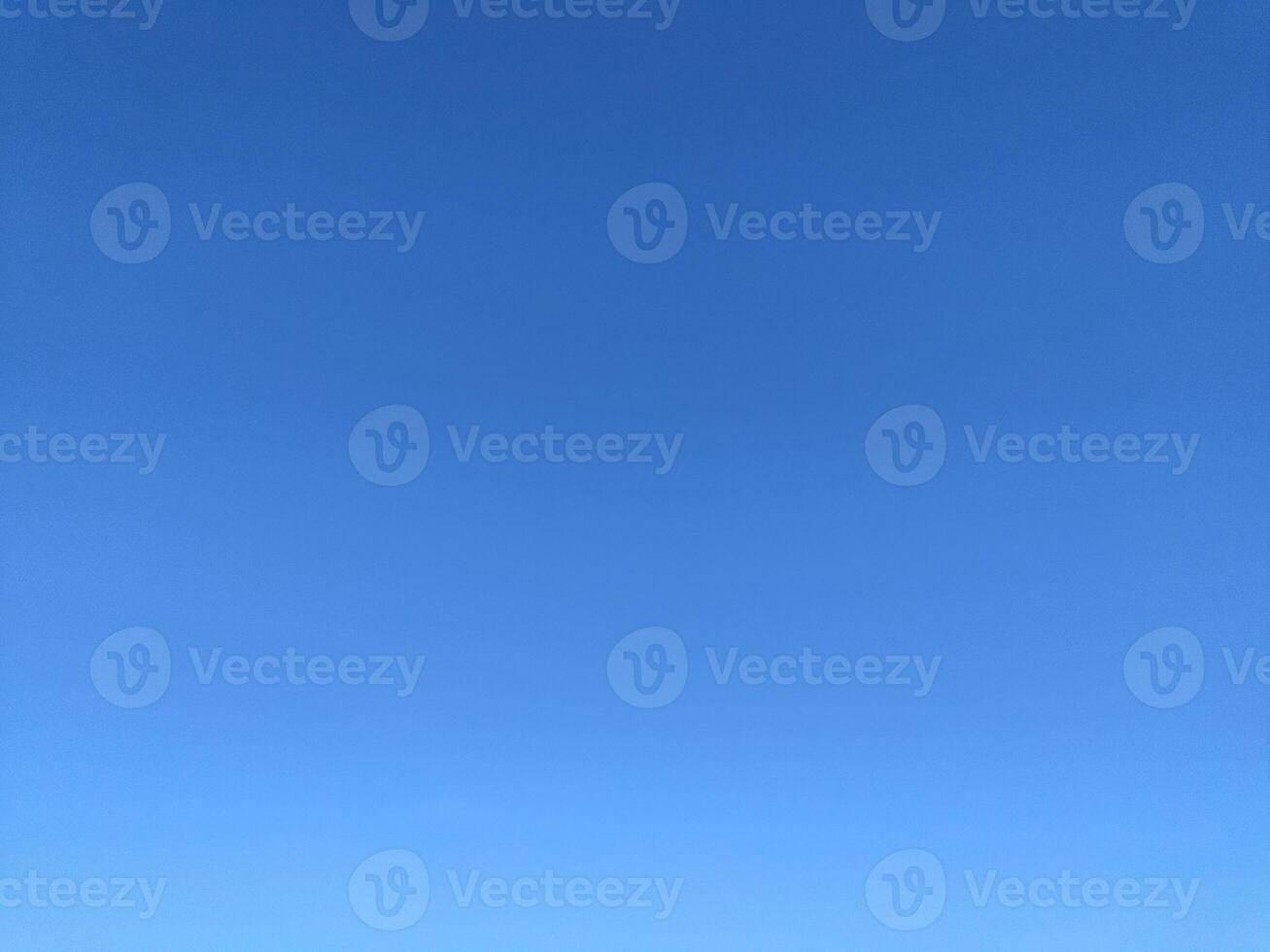 Clear blue sky texture and white fluffy cloud nature background. The sun shines bright in the daytime in summer photo