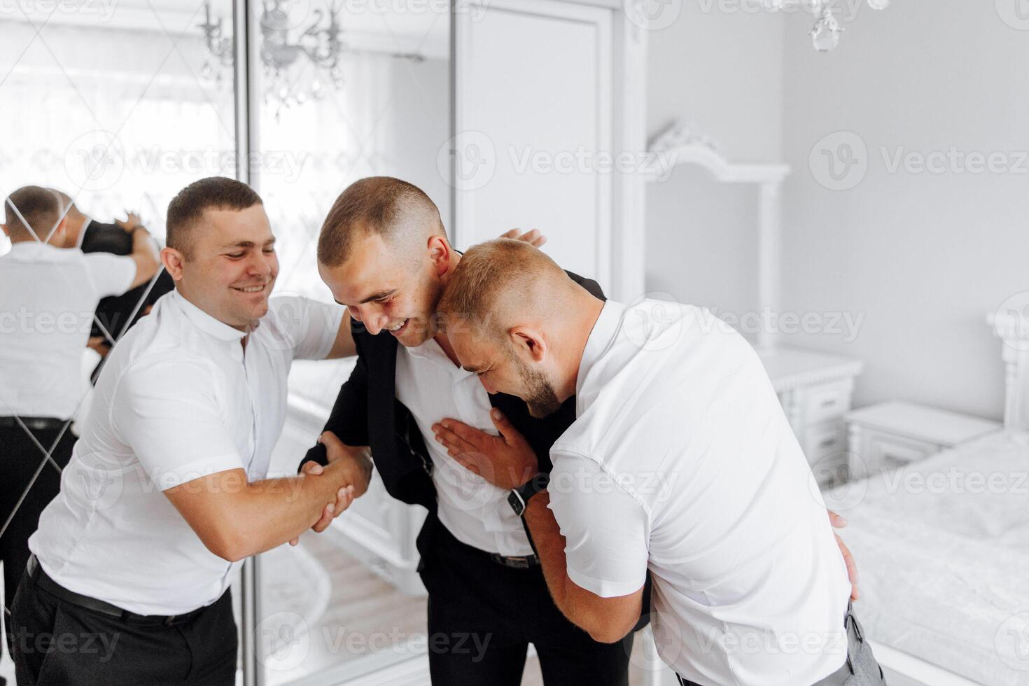 Three men are hugging each other in a bedroom photo