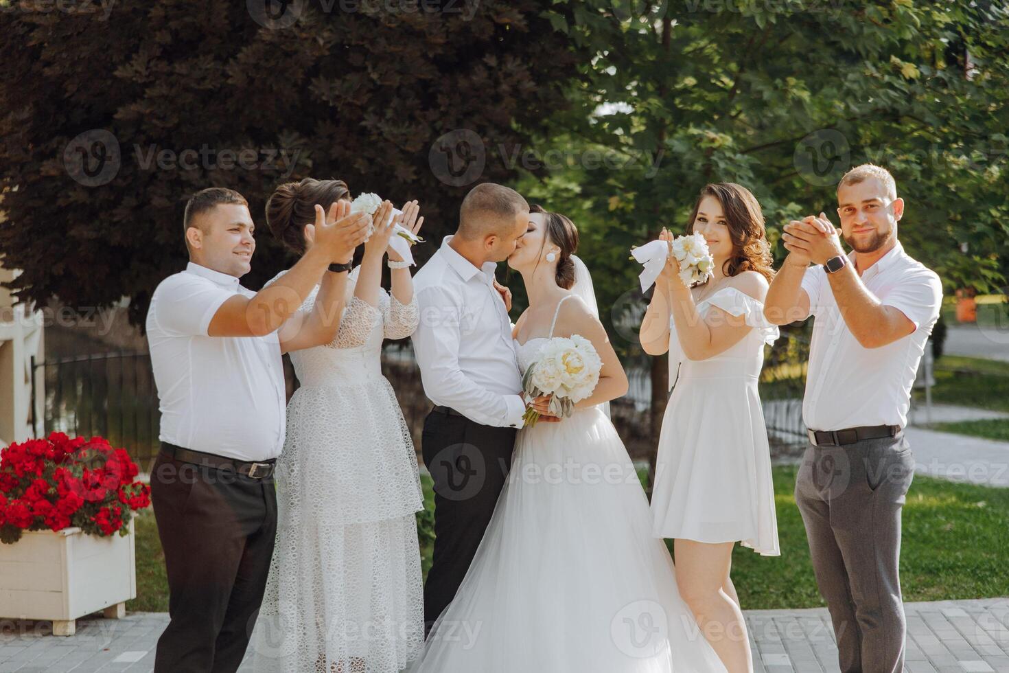 A group of people are posing for a picture, with a bride and groom in the center photo