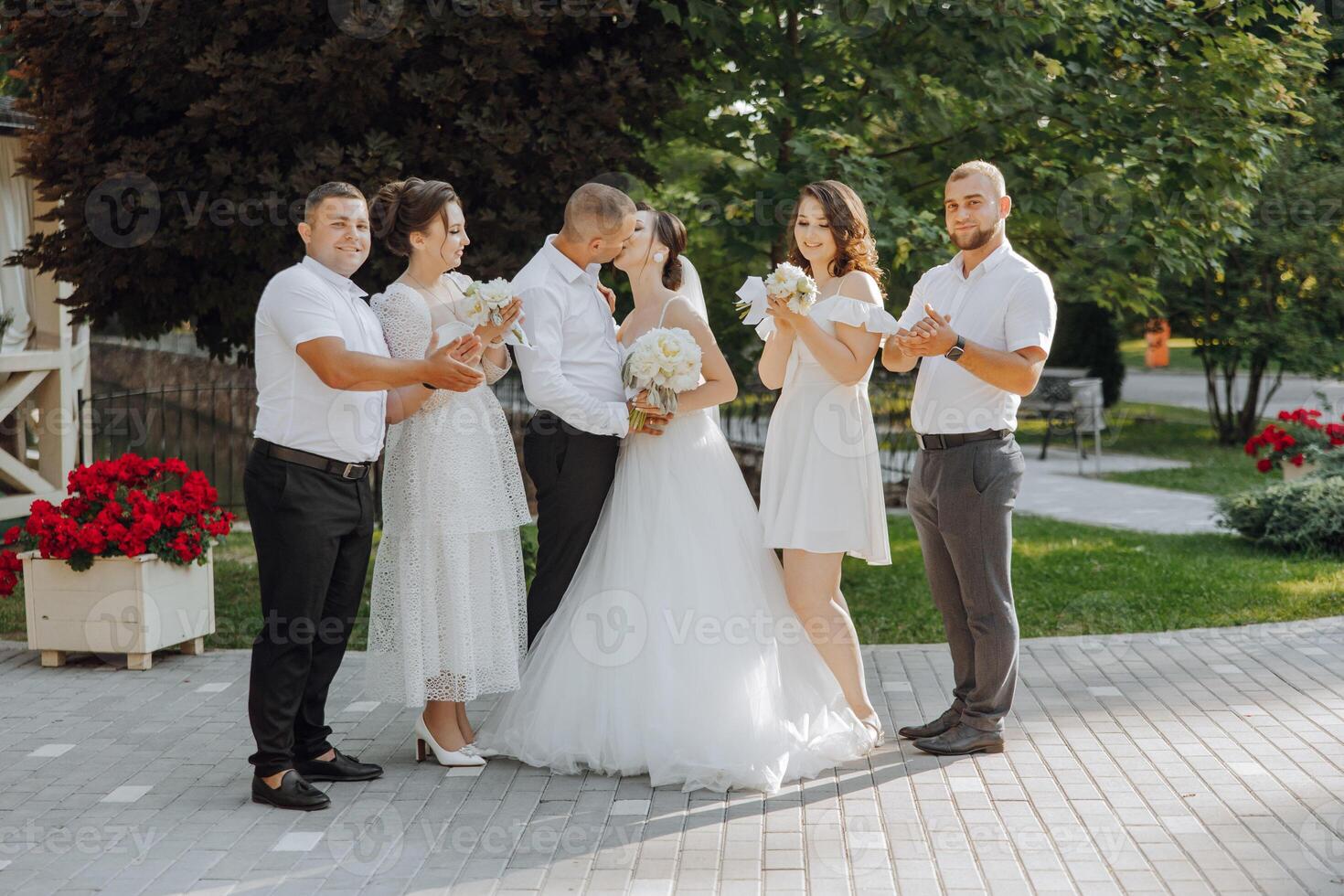 A group of people are posing for a picture, with a bride and groom in the center photo