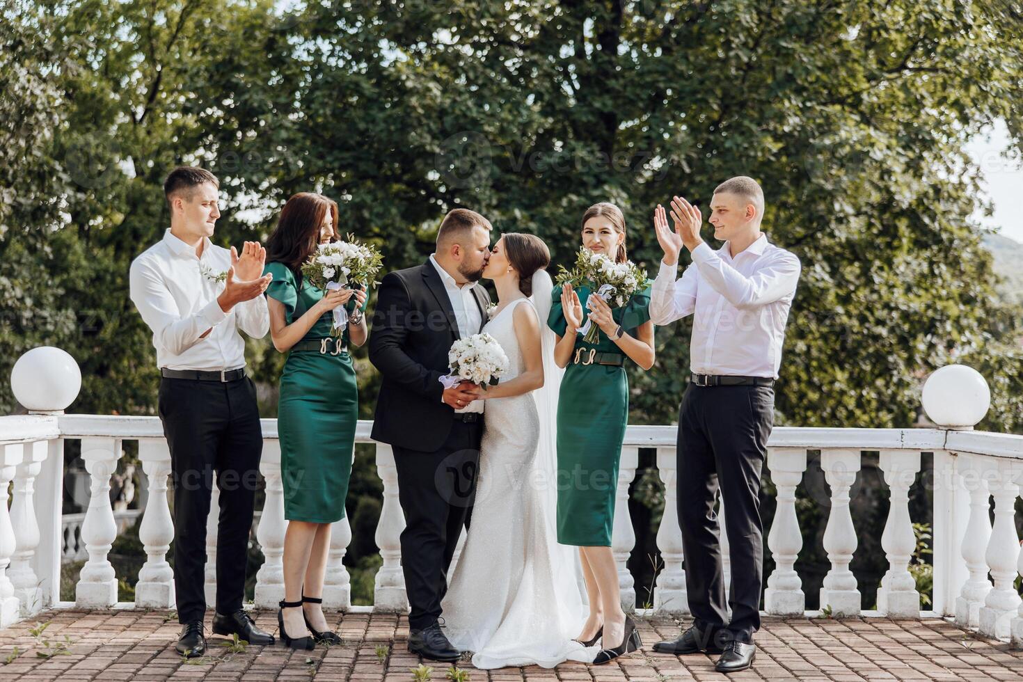 A group of people are posing for a picture, with a bride and groom in the center photo