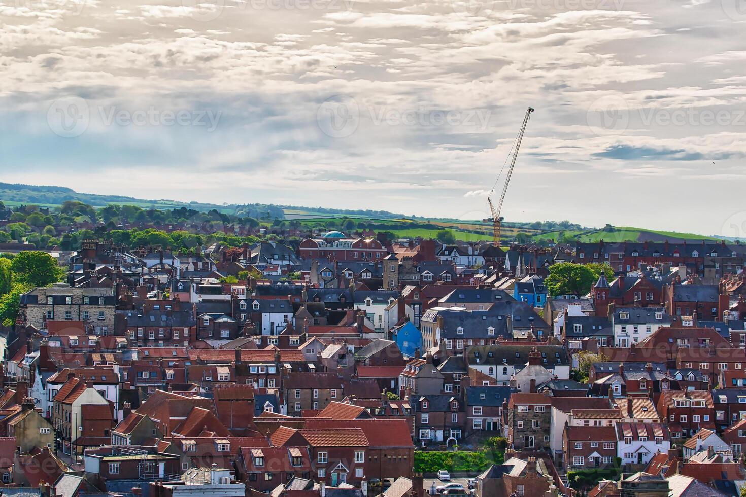 Aerial view of a small town with red-roofed houses in Whitby, North Yorkshire photo