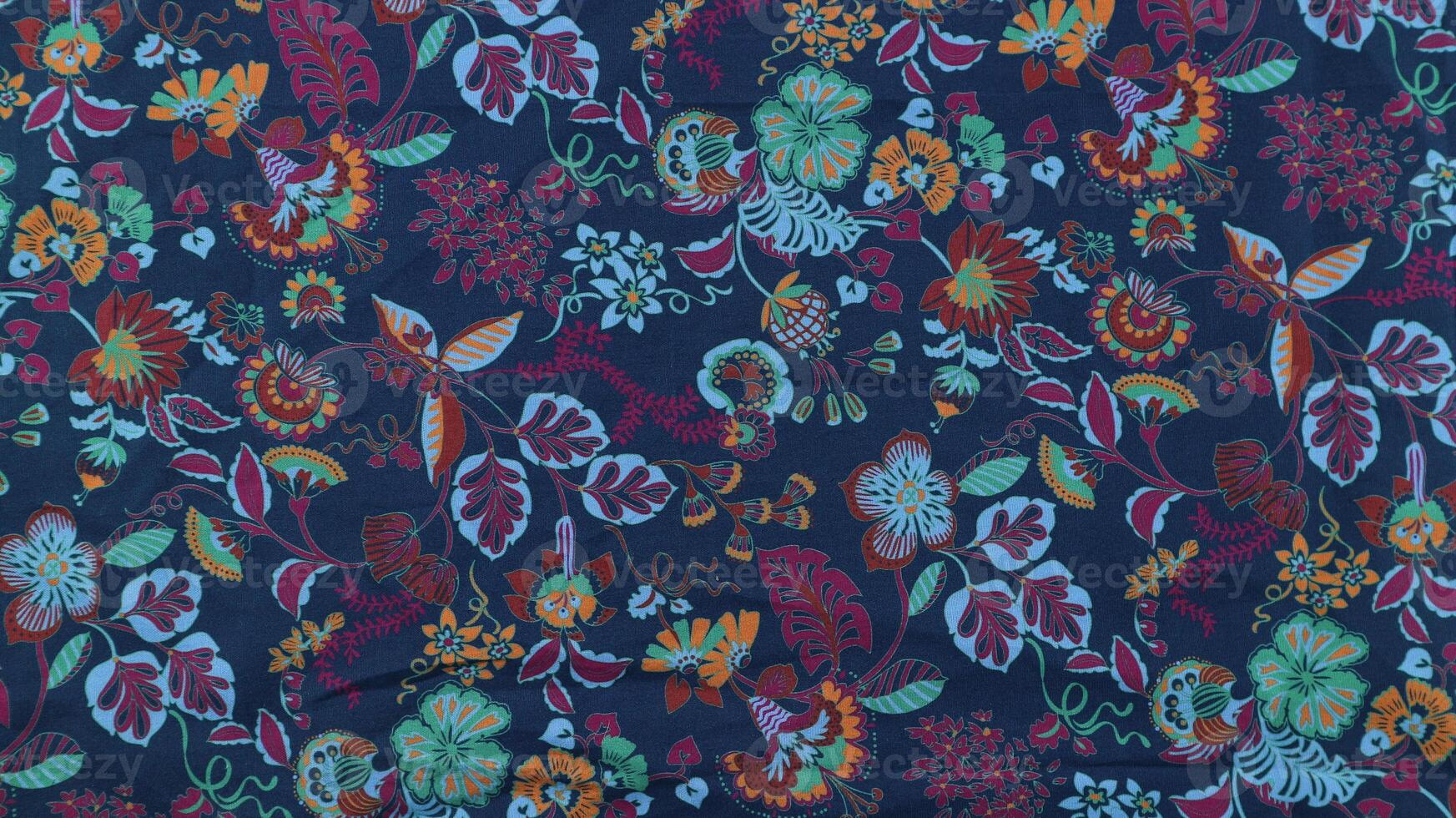 colorful Floral summer fabric pattern. Blue and pink flowers on a black background. photo