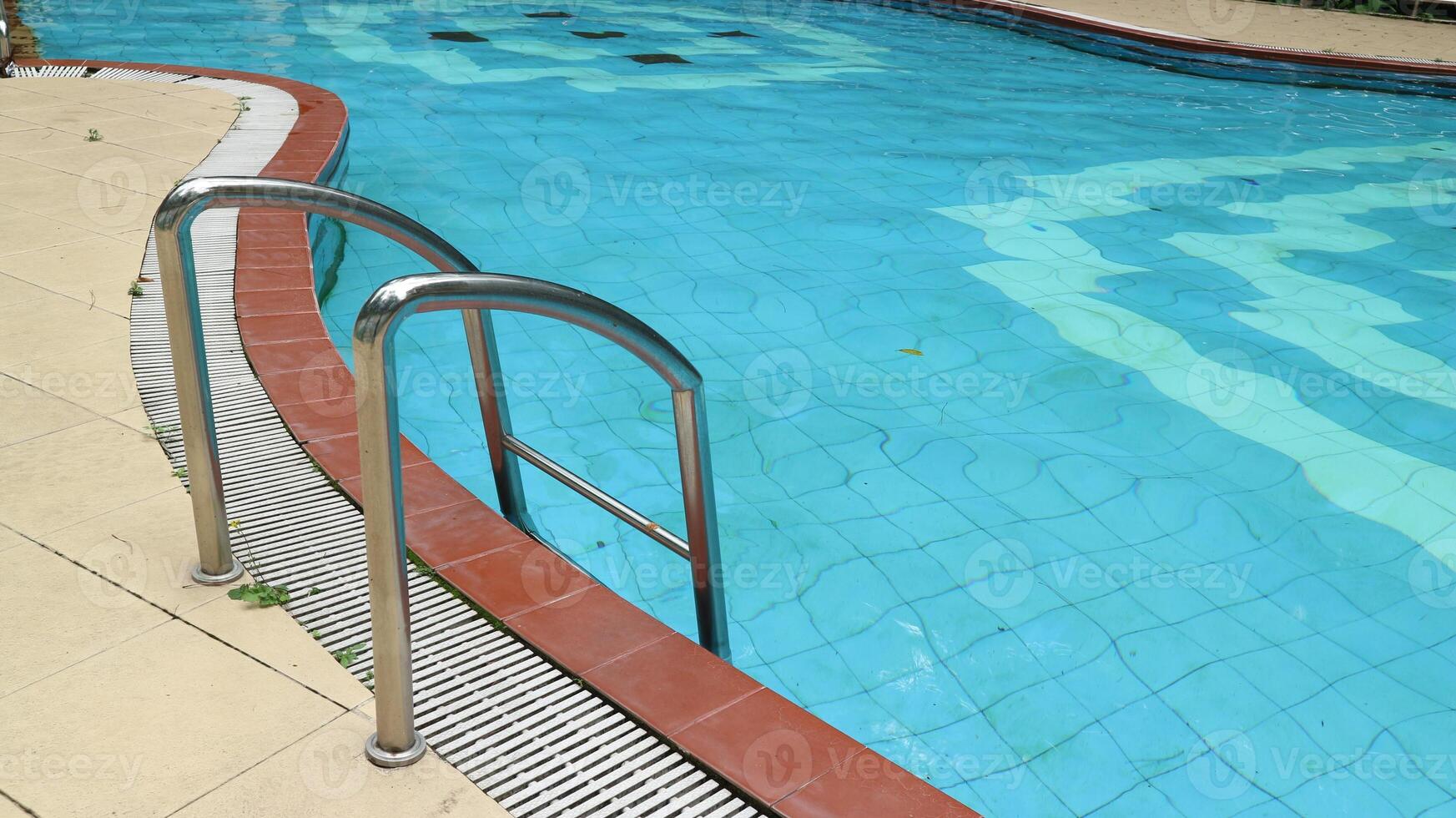 Swimming pool with stairs, swimming pool handrails photo