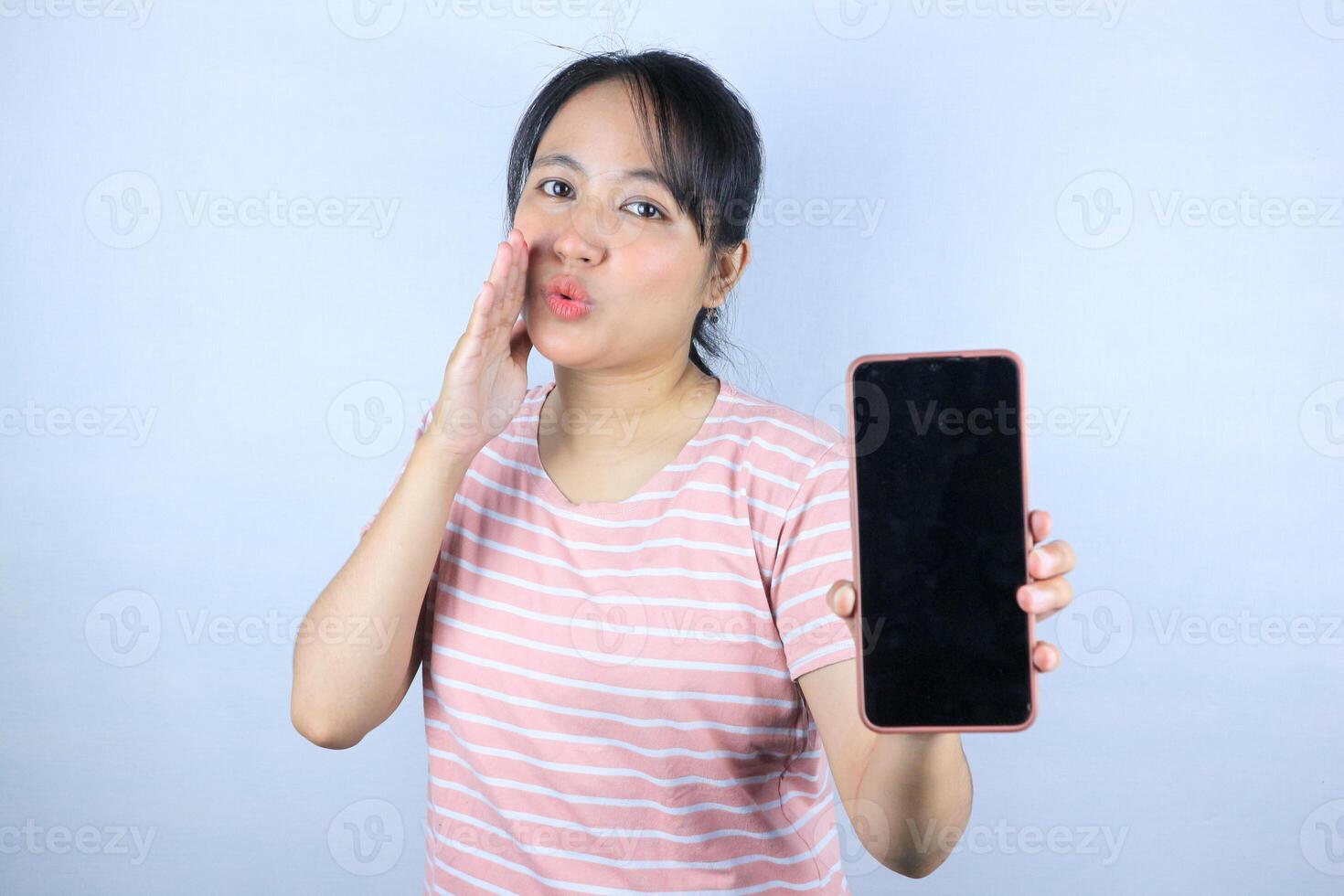 Beautiful Asian woman gesturing whispering announcements, gossip, latest news or shopping discounts photo