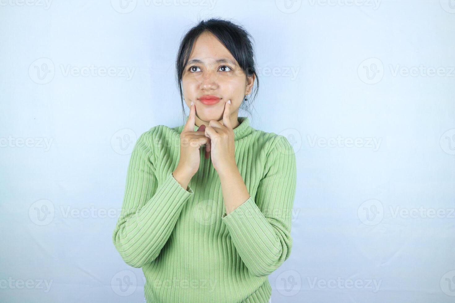 Young asian woman standing pose thinking on isolated white background. photo