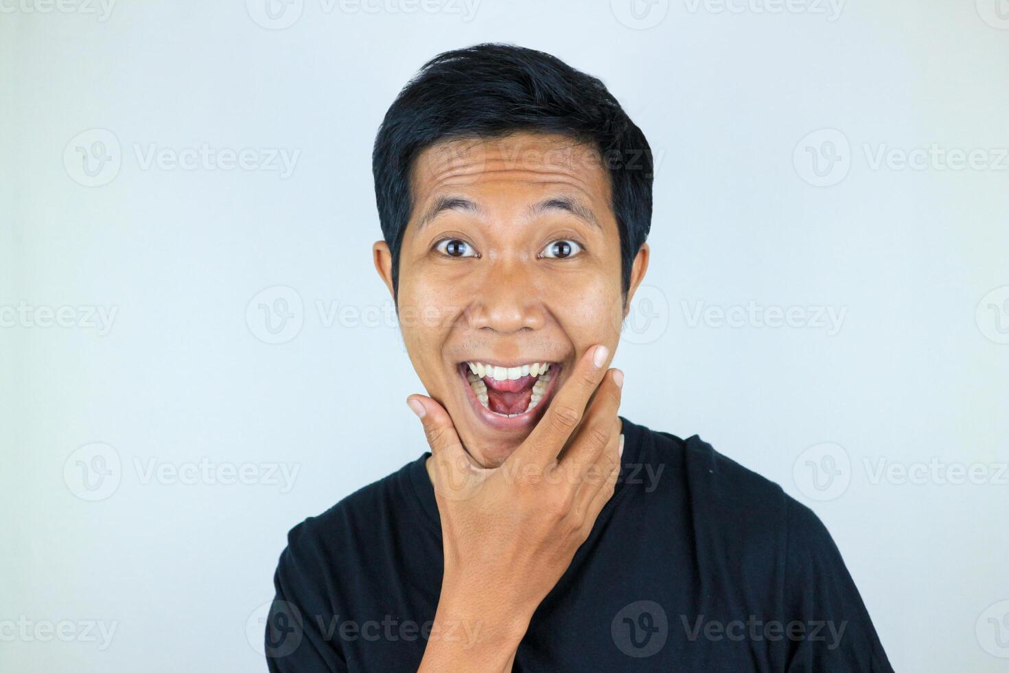 head shot wow facial expression smiling asian man looking at the camera, isolated white background photo