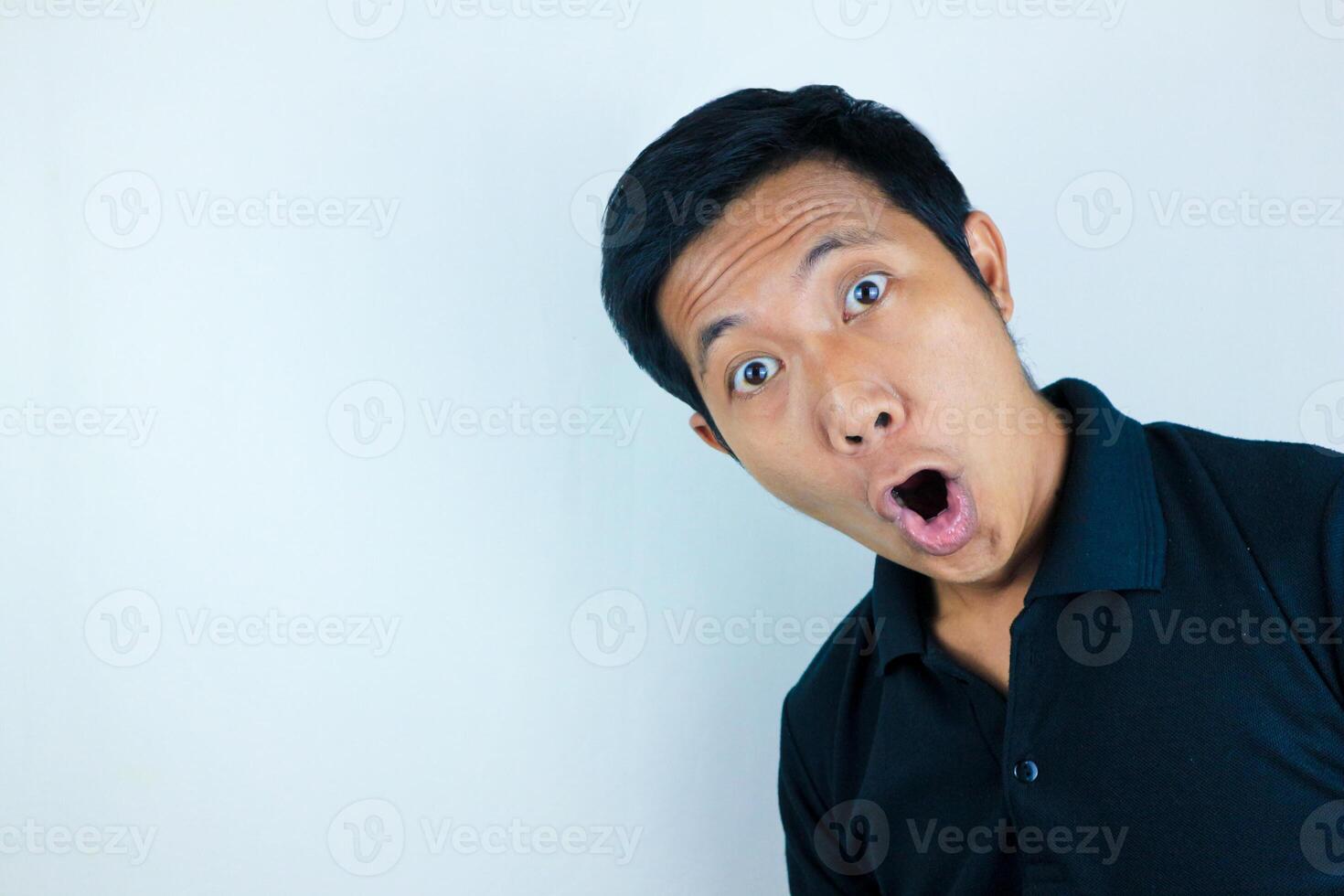 funny expression of shocked and surprised Asian man isolated on white background photo