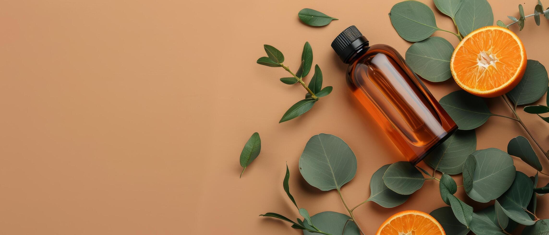 Two Oranges and a Bottle of Perfume on a Table photo