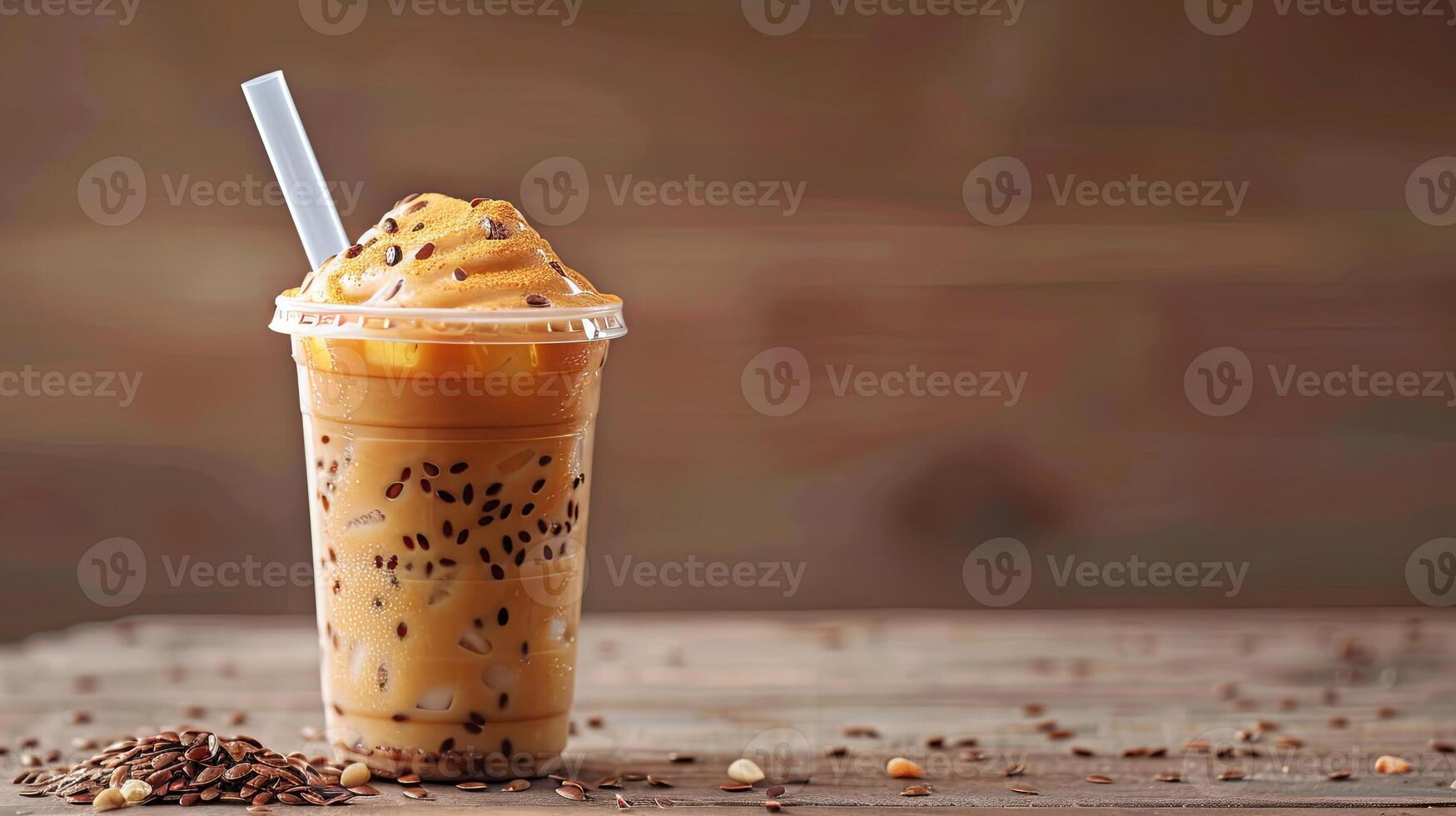 Thai tea in a plastic cup with ice and a straw photo