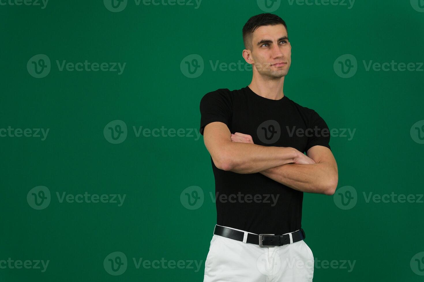fold hands on chest man sexy businessman wearing glasses standing with arms crossed to chest and posing happy on white studio background photo