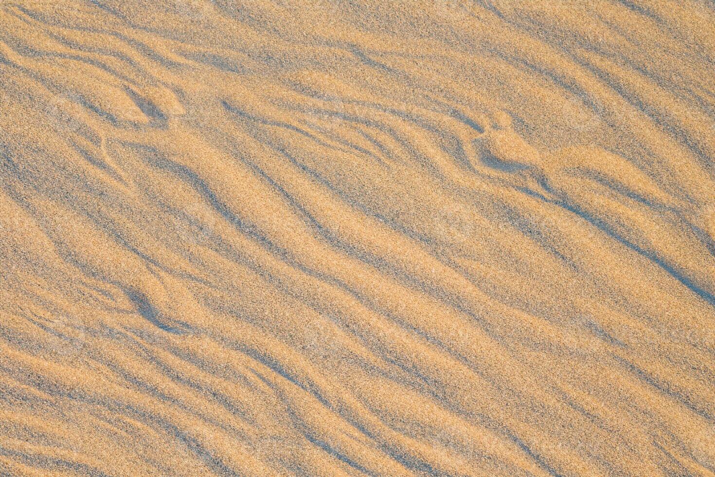 Beholding the Beauty of a Beach with Natural Motif Sands from Above, a Serene Coastal Vista photo