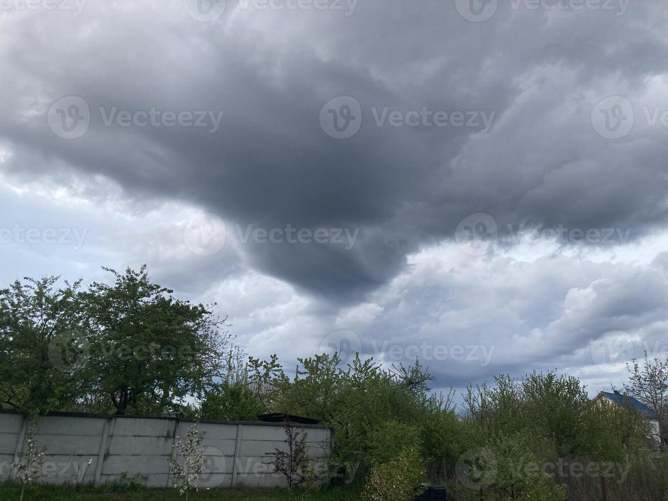 Thunderclouds before rain in the village photo