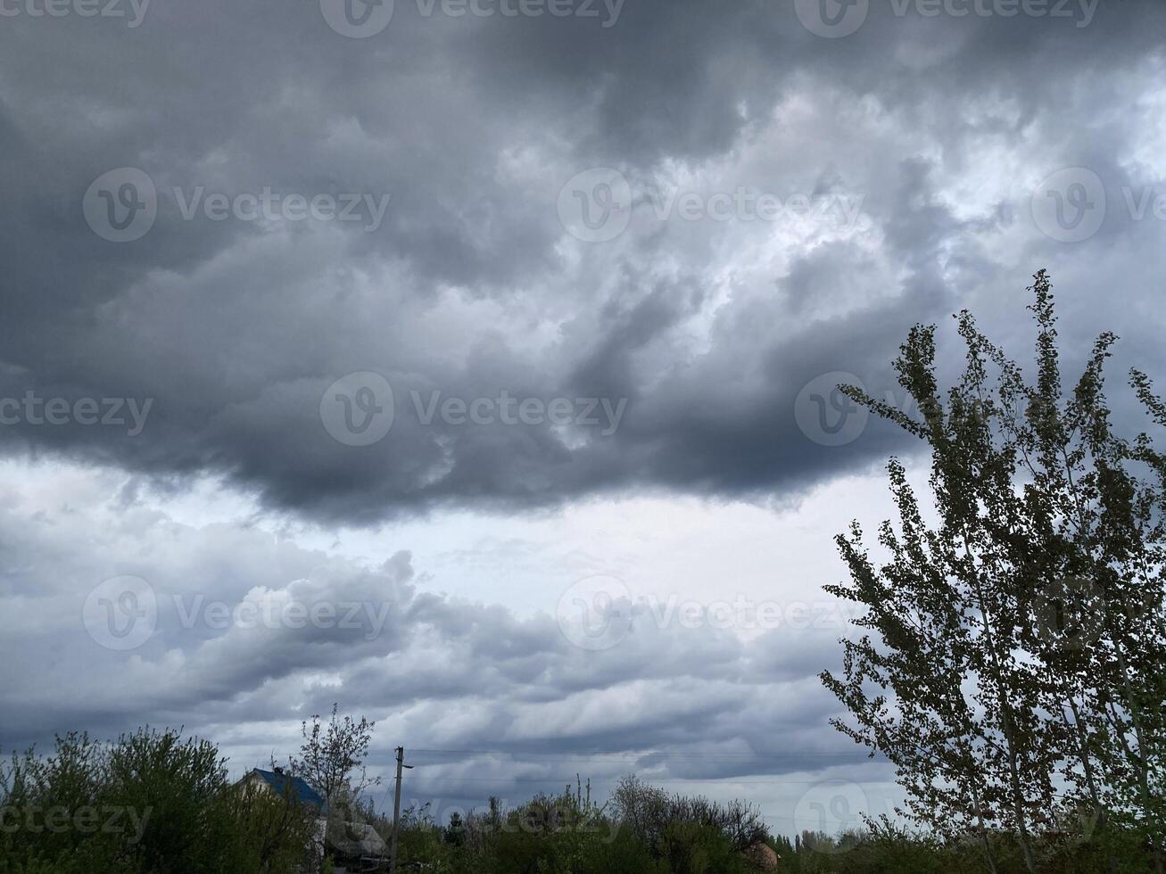 Thunderclouds before rain in the village photo