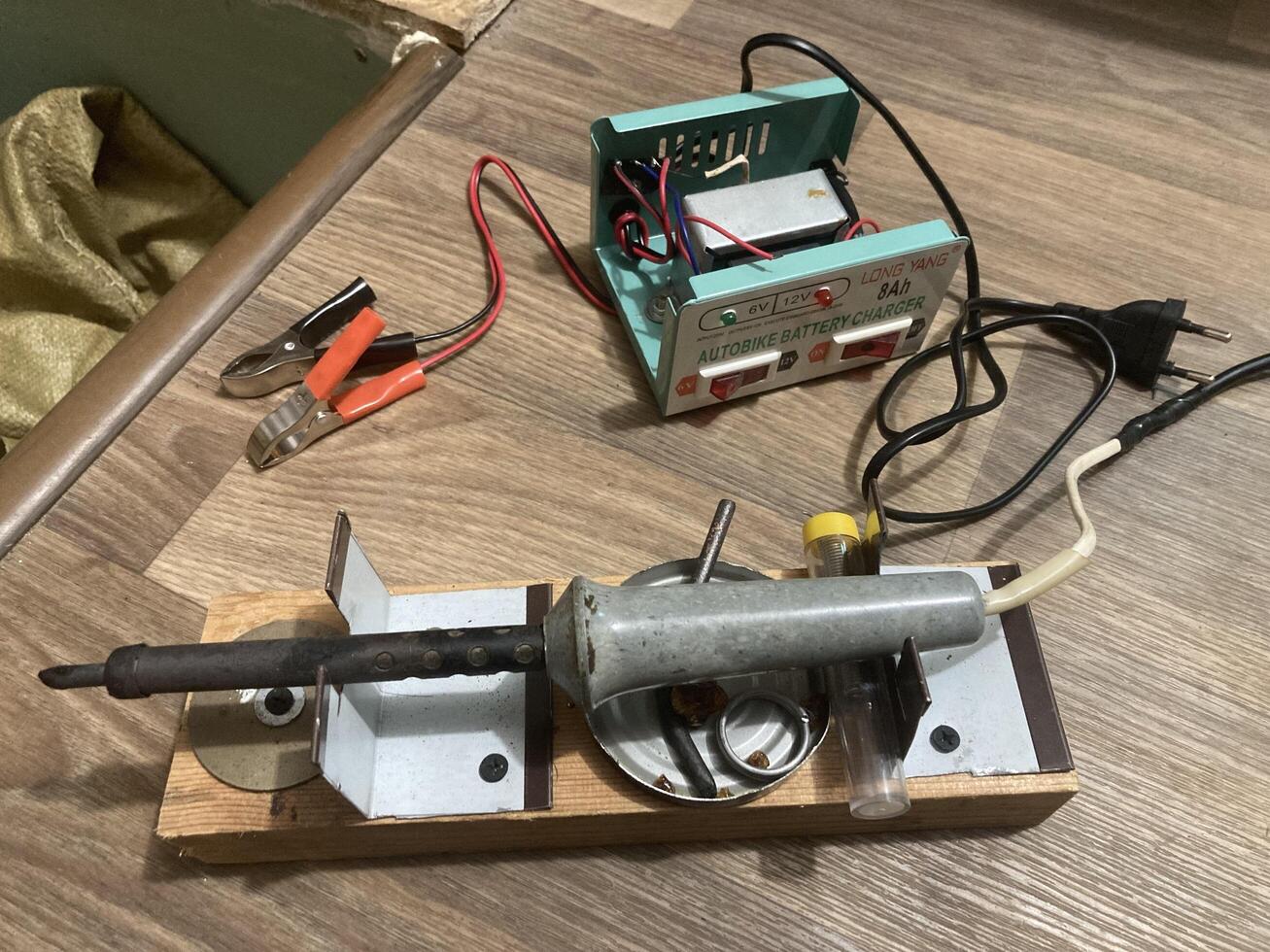 KYIV, UKRAINE - April 28, 2024 Battery charger repair photo