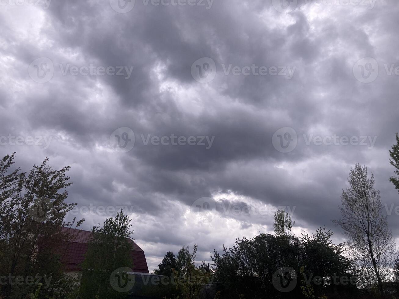 Thunderclouds before rain in the village photo