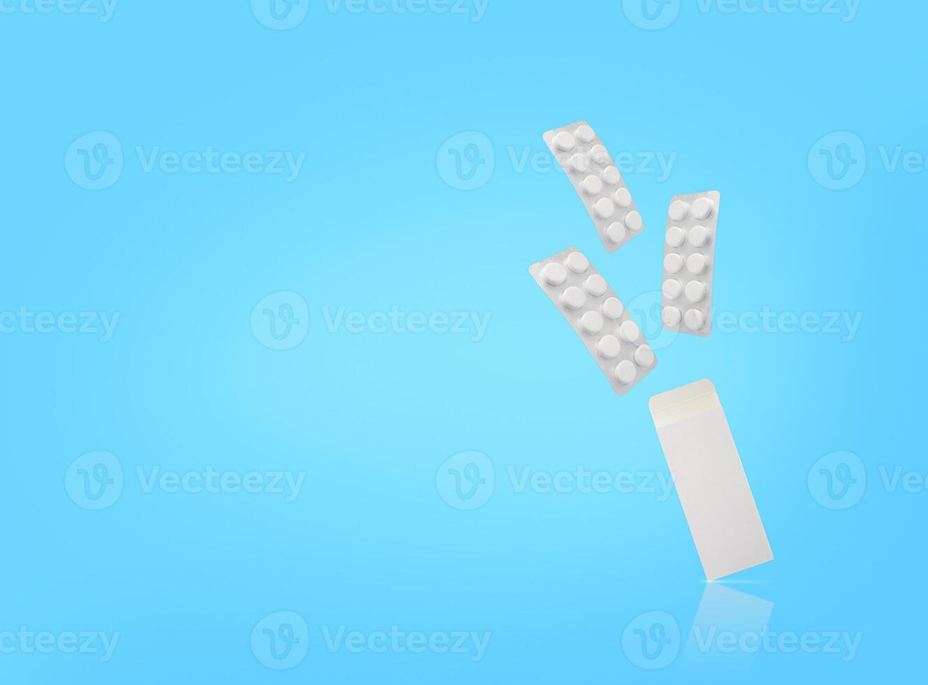Three blisters of tablets and package are floating on blue backdrop. Copy space. Stock photo