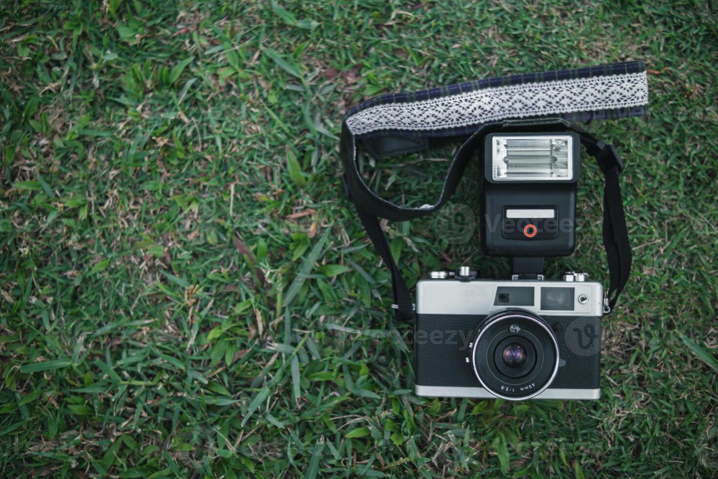 Vintage style film cameras are back in use today because film cameras are classic and have a beautiful shape that gives image unique tone causing some photographers to turn to film cameras. Copy Space photo
