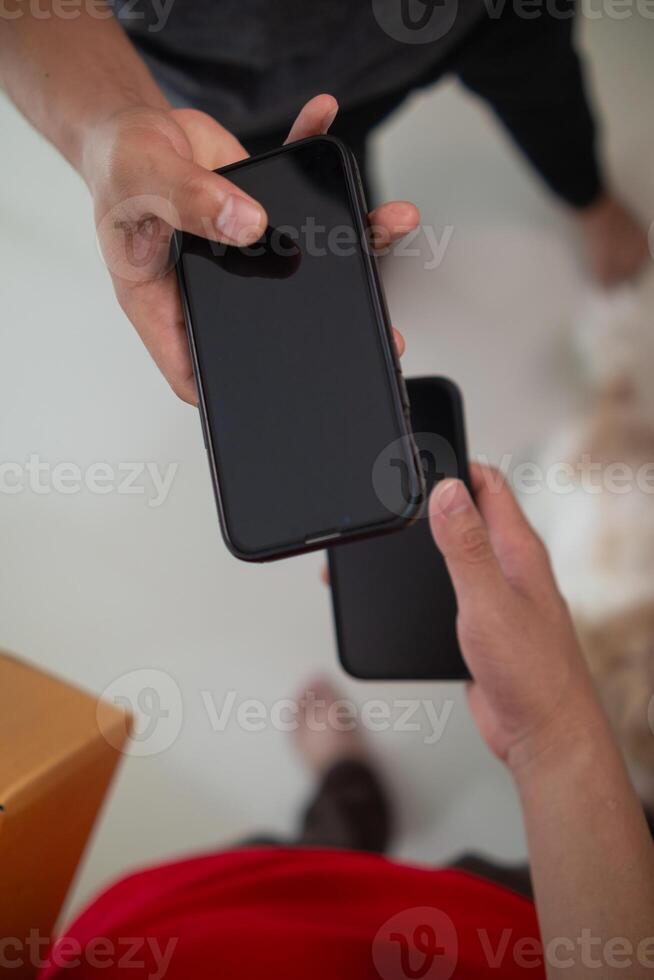 SME business operator is inspecting and packing products into parcel box for delivery company that will come pick up products after participating in online marketing with Application shopping online photo