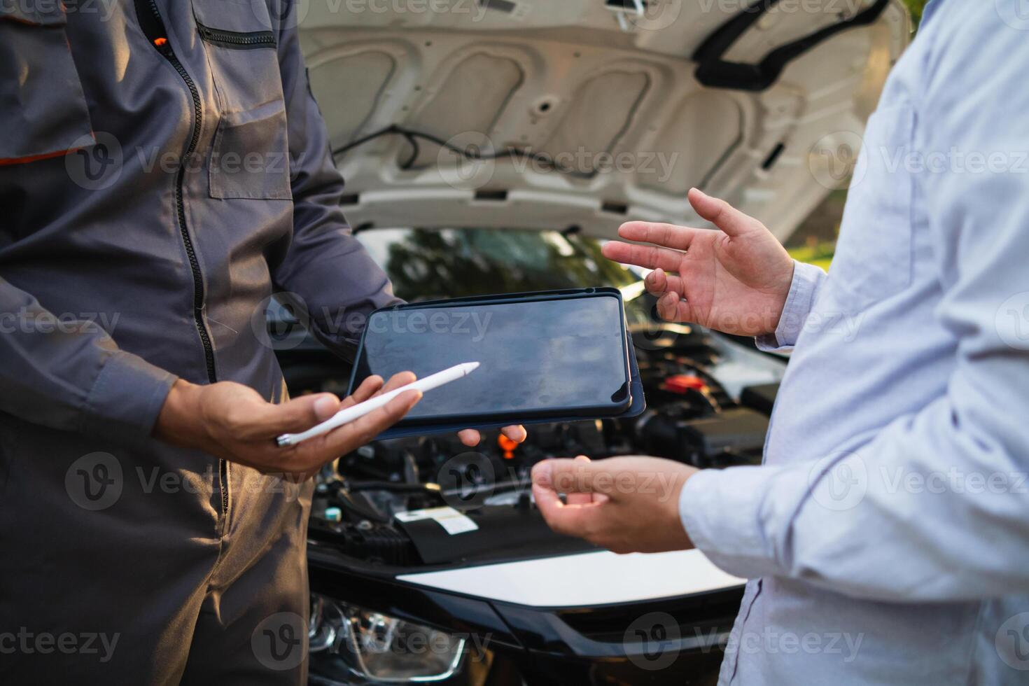 car service center mechanics are checking condition car and engine make sure they are ready use and in perfect condition according center warranty. periodic vehicle inspections for safety in driving. photo