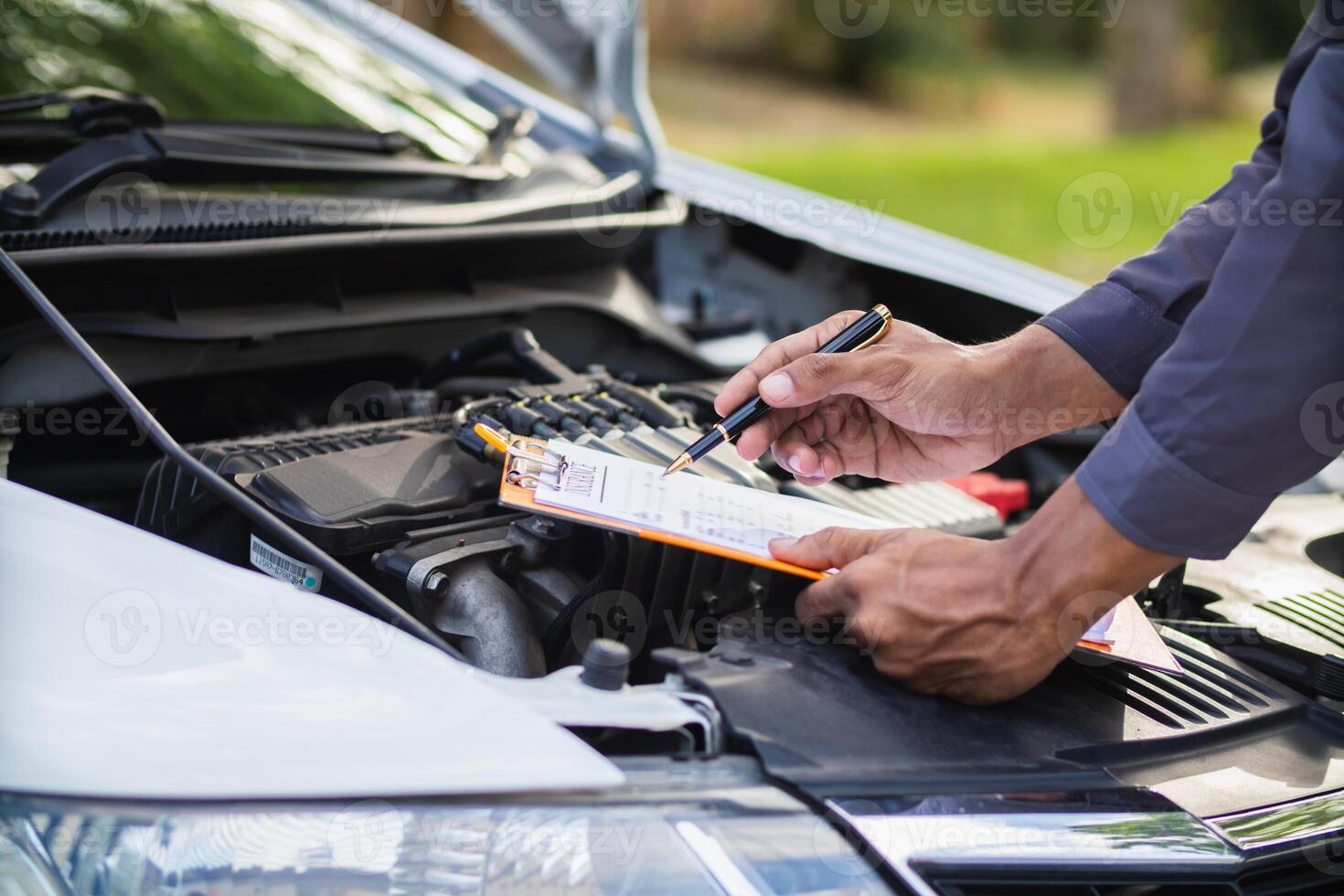 car service center mechanics are checking condition car and engine make sure they are ready use and in perfect condition according center warranty. periodic vehicle inspections for safety in driving. photo
