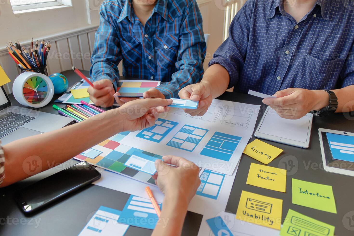 mobile application development team is studying and designing ux ui system to display and color in application on smartphone to work efficiently and not cause the ux ui system to have any errors. photo