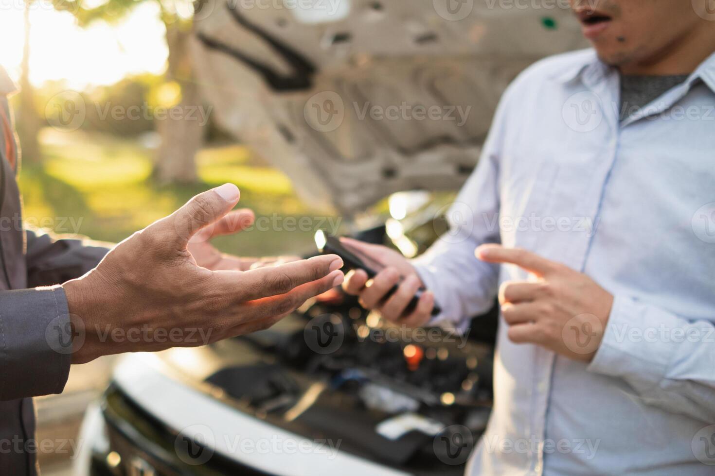 Technicians from service center inspect and assist customers cars that are having problems while traveling build confidence in customers who choose buy car from service center and receive help quickly photo