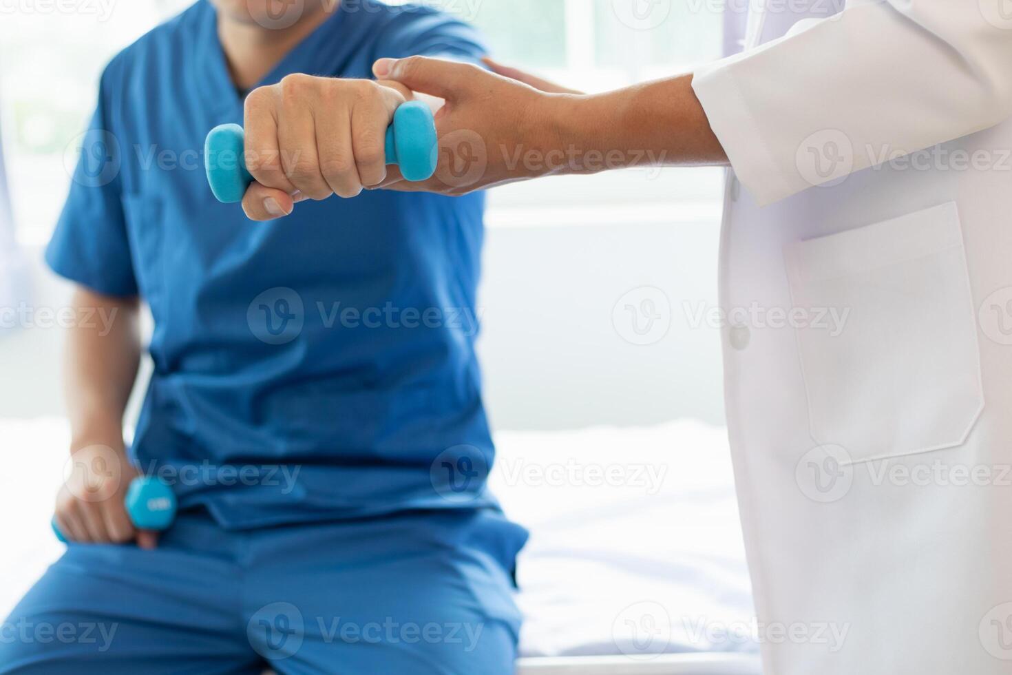doctor is helping a patient move her muscles after recuperating from a muscle injury and wanting to rehabilitate her to be able to use her normal daily life with continuous physical therapy. photo