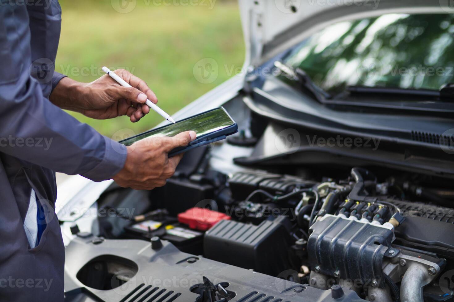 car service center mechanics are checking condition car and engine make sure they are ready use and in perfect condition according center warranty. periodic vehicle inspections for safety in driving. photo