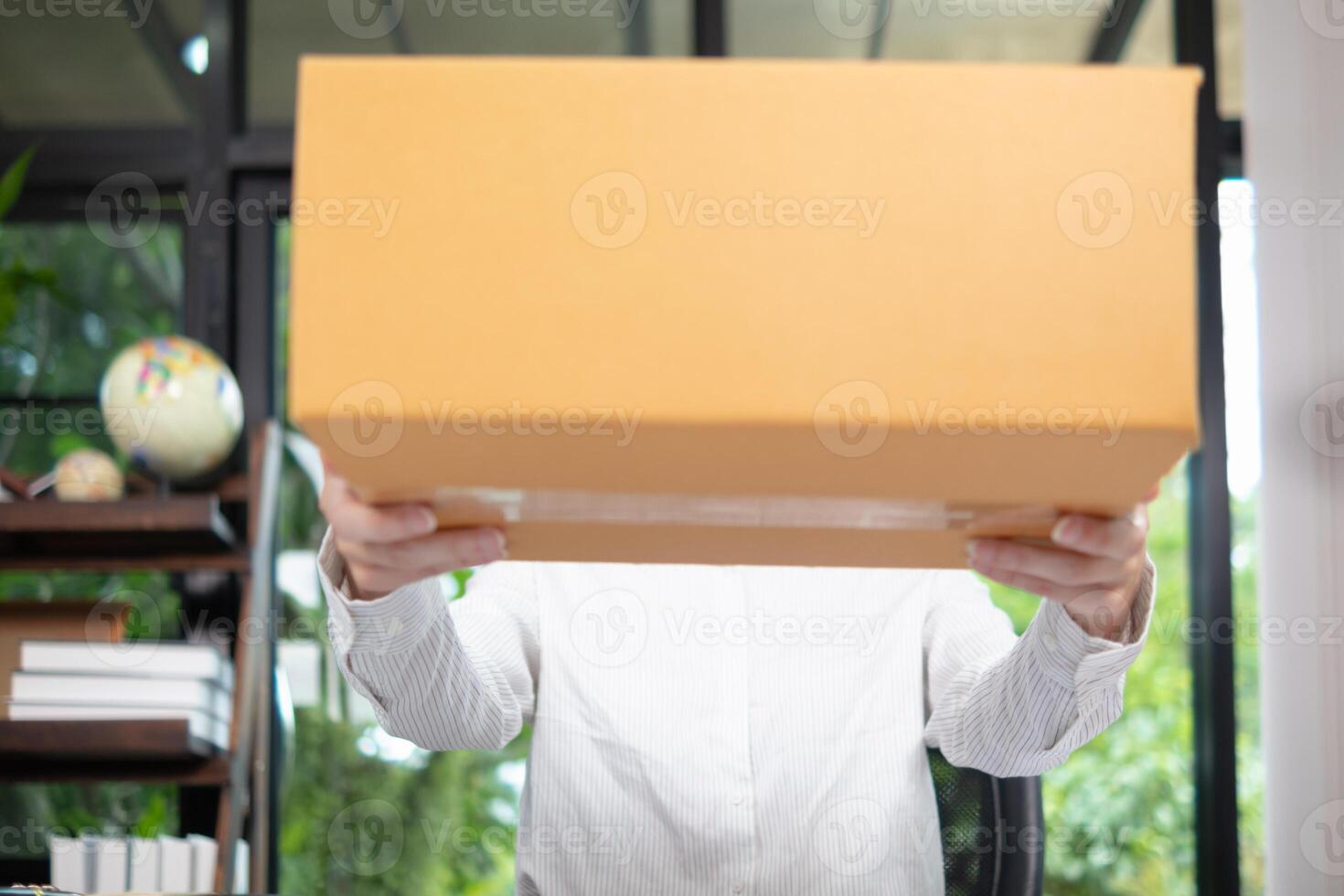 SME business operator is inspecting and packing products into parcel box for delivery company that will come pick up products after participating in online marketing with Application shopping online photo
