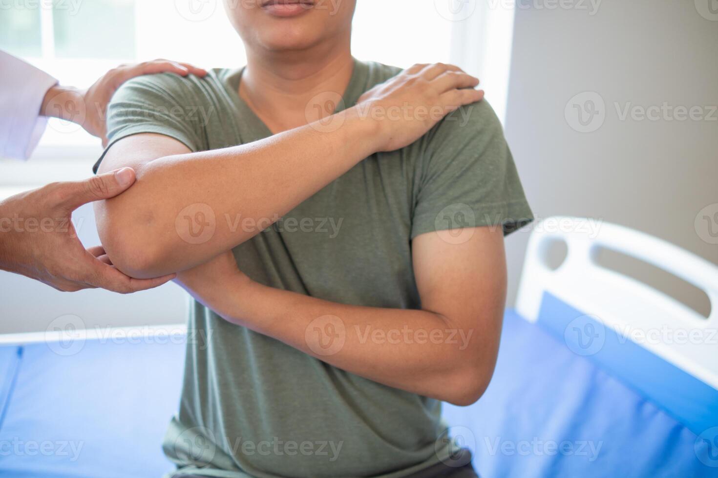 doctor is helping a patient move her muscles after recuperating from a muscle injury and wanting to rehabilitate her to be able to use her normal daily life with continuous physical therapy. photo