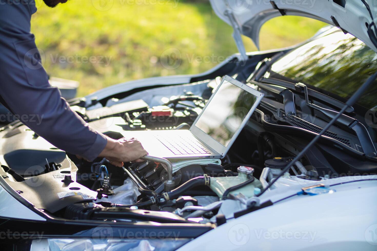 car service center mechanics are checking condition car and engine make sure they are ready use and in perfect condition according center warranty. periodic vehicle inspections for safety in driving. photo
