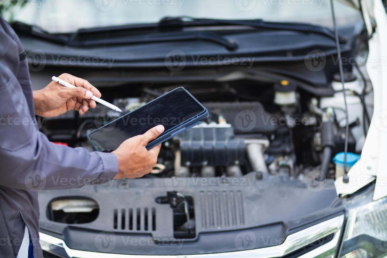 car service center mechanics are checking condition car and engine make sure they are ready use and in perfect condition according center warranty. periodic vehicle inspections for safety in driving. photo