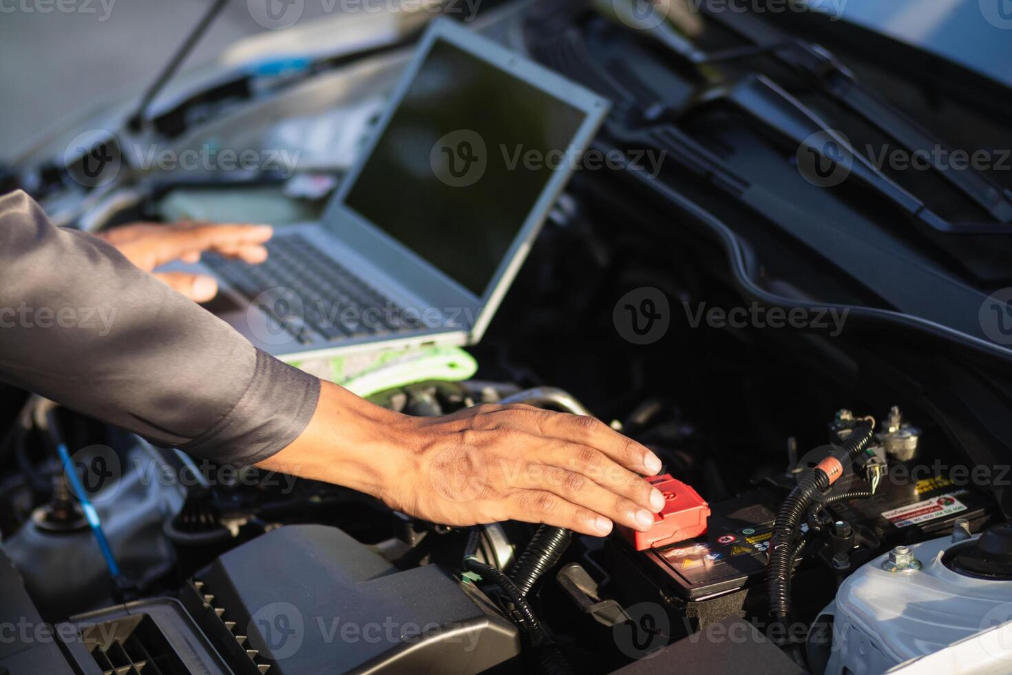 car service center mechanics are checking condition car and engine make sure they are ready use and in perfect condition according center warranty. periodic vehicle inspections for safety in driving. photo