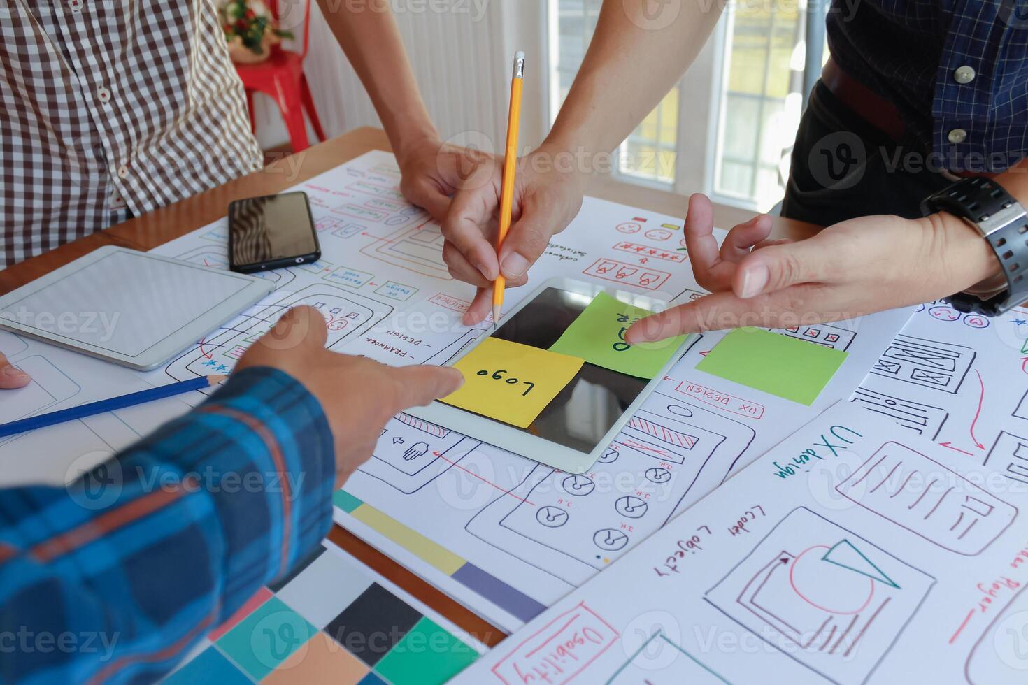 mobile application development team is studying and designing ux ui system to display and color in application on smartphone to work efficiently and not cause the ux ui system to have any errors. photo